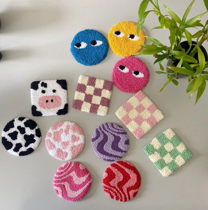 The punch needle coasters featuring a variety of playful designs