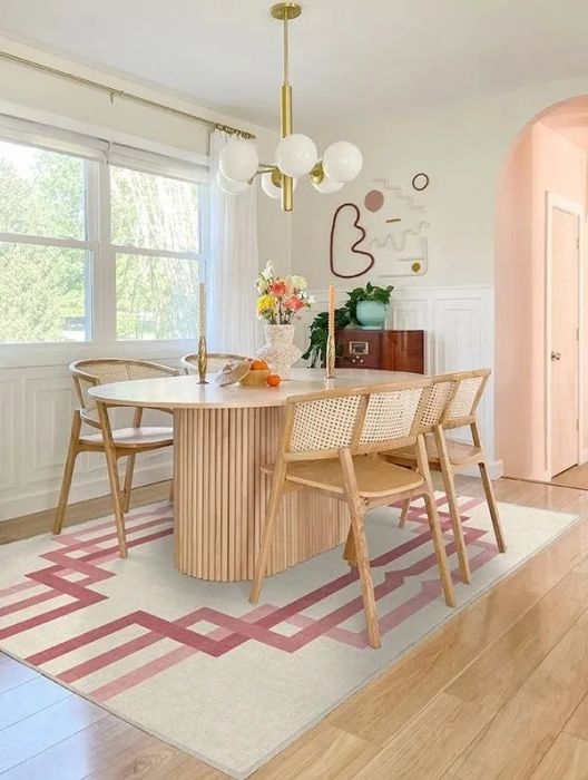 white rug featuring a pink ombre gradient design