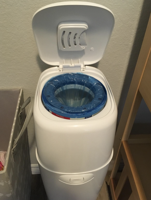 A reviewer’s photo of the Diaper Genie with its lid open