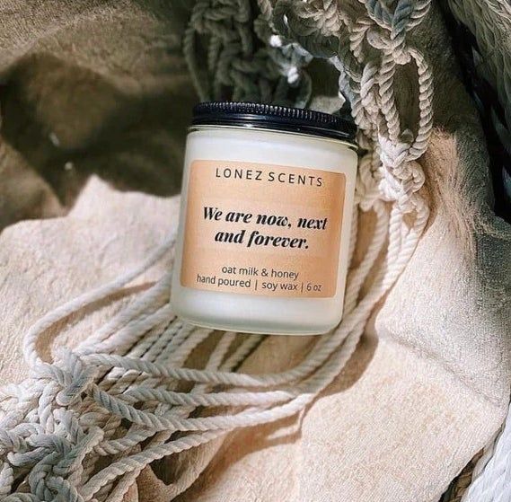 A candle rests in a basket.