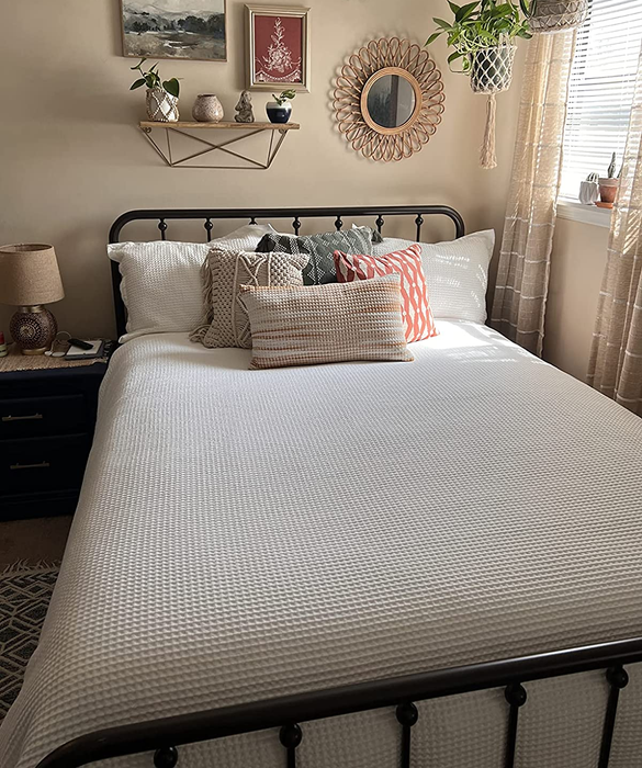 Reviewer photo showcasing a crisp white duvet cover elegantly spread on a bed.
