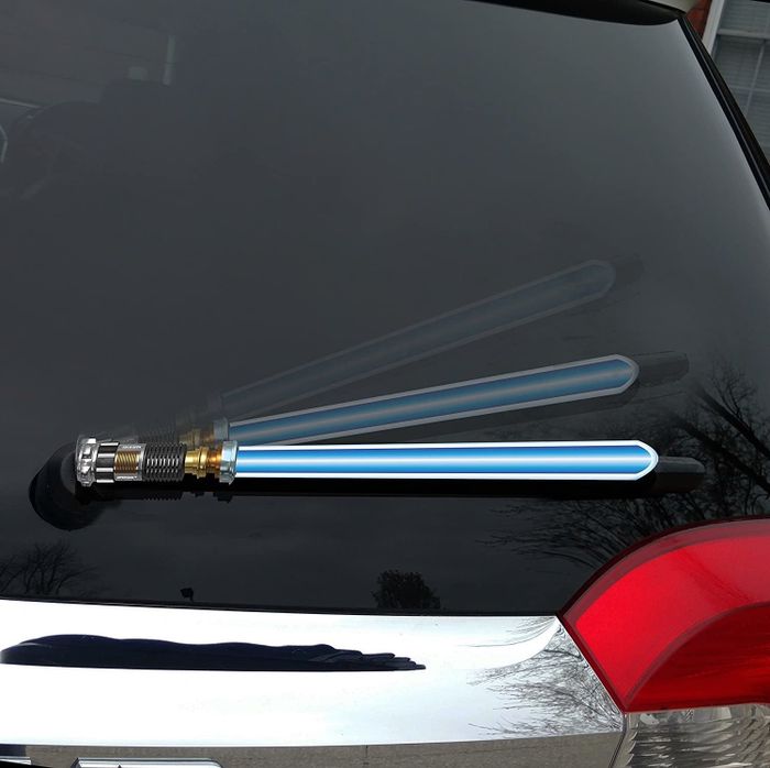 An image of the lightsaber wiper blade cover installed on a car windshield