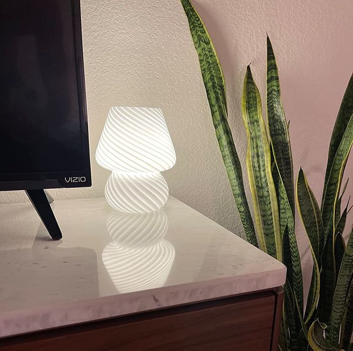 A reviewer’s white lamp placed on a table