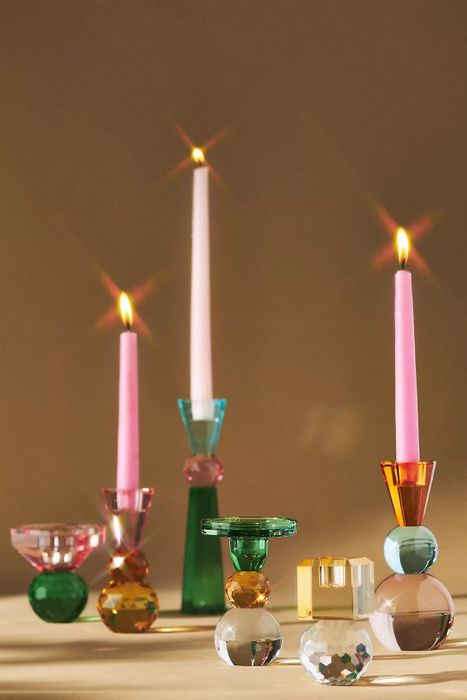 Candles glowing in beautifully designed holders, perfect for an elegant home decor setup.
