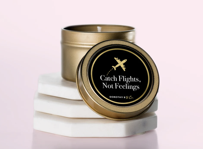 A travel tin candle is shown.