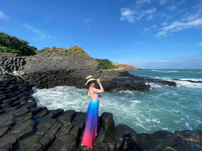Overhead shot of a sleek gray duvet cover neatly spread across a bed.