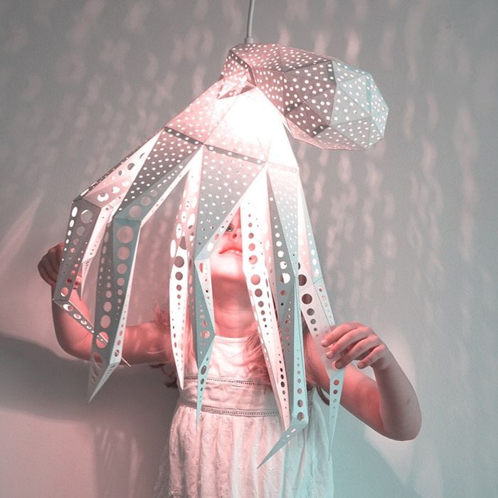 A child interacts with the octopus light