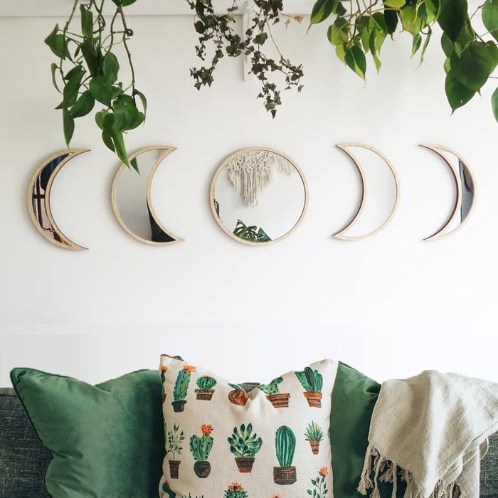 The mirror displayed above a sofa