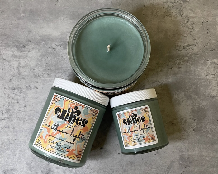 A set of three candles is displayed.