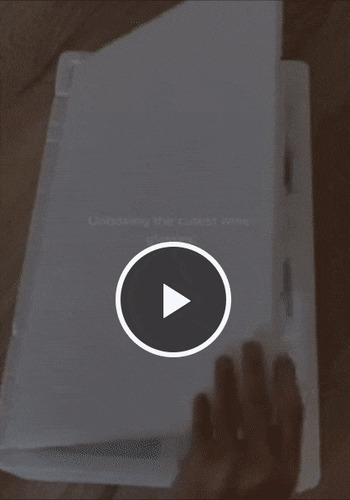 A reviewer unboxing the glasses and displaying them stacked neatly on a table