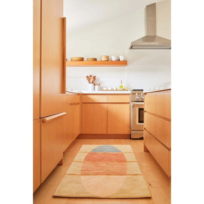beige, orange, and blue geometric-patterned runner rug in a kitchen setting