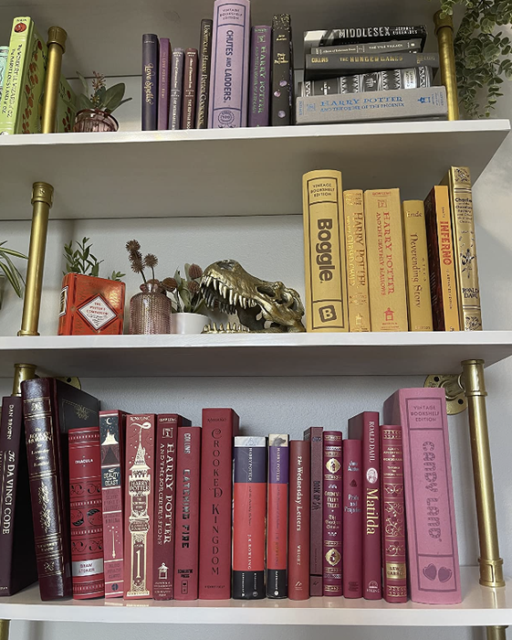 reviewer's bookshelf with several versions of these games subtly integrated into the collection