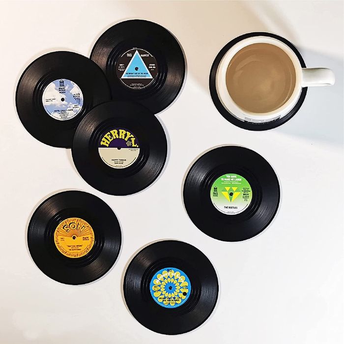 A collection of vinyl record-shaped coasters, perfect for your home.