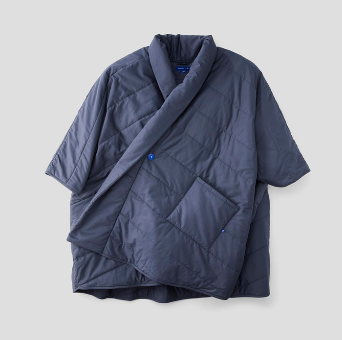 A close-up of the wrap featuring a front pocket, sleeves, and a collar for added warmth and style