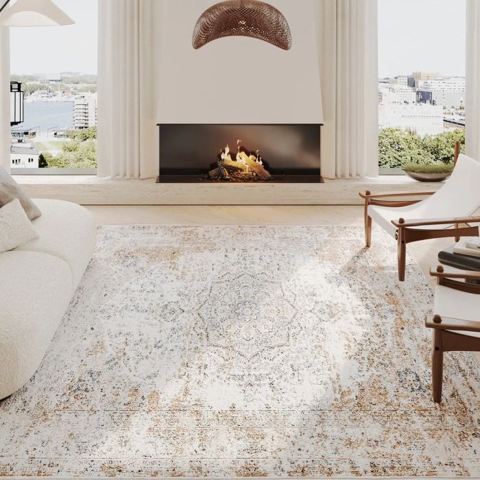 A beige vintage-style rug placed in a living room.