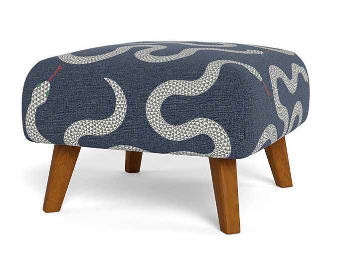 ottoman with a denim-like texture and snake print cover