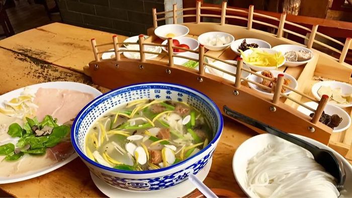 Experience the unique Crossing Bridge Noodles, a specialty of Yunnan, China.