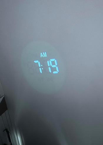 A projection clock showing the time.