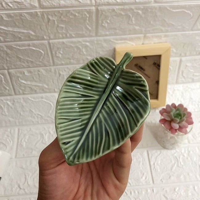 A petite trinket dish shaped like a delicate leaf.
