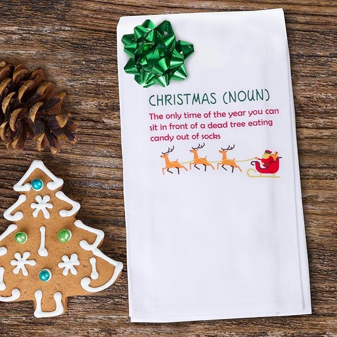 A dish towel featuring a hilarious definition of Christmas