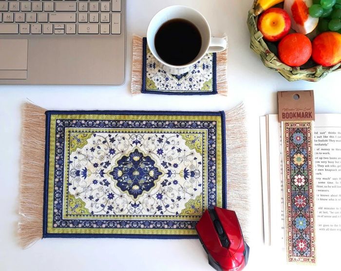 a close-up of the blue and green mouse pad paired with its matching coaster