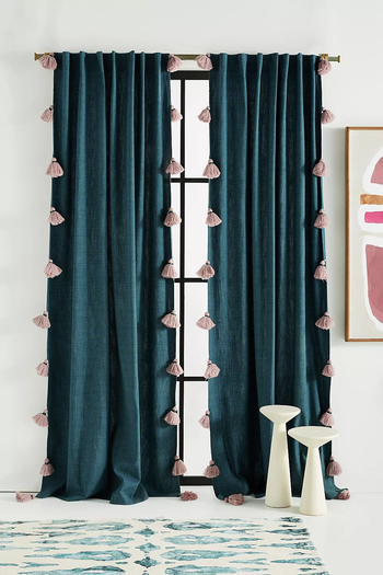 navy blue curtains featuring pink tassel trim