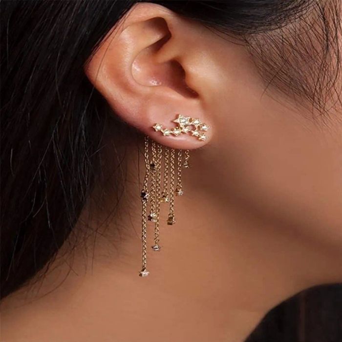 A model showing off the earrings in a gorgeous gold finish.