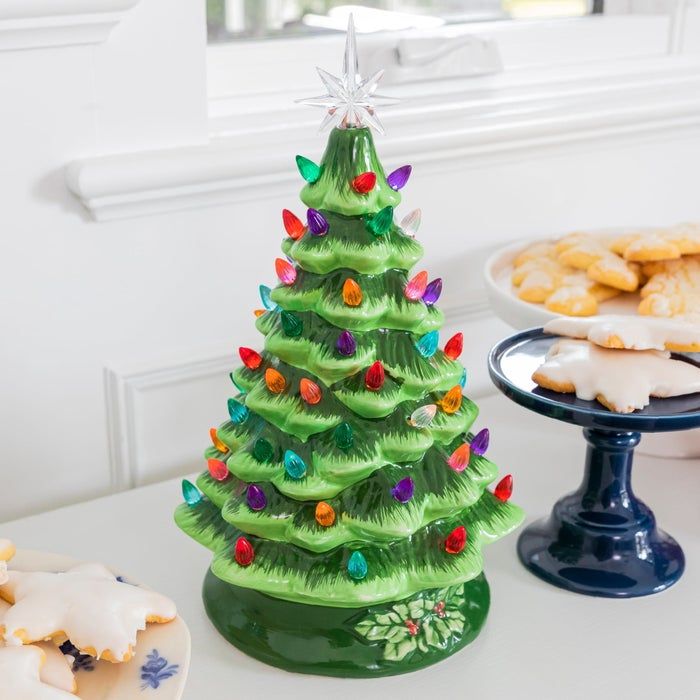 a ceramic tabletop Christmas tree with multicolored glowing lights