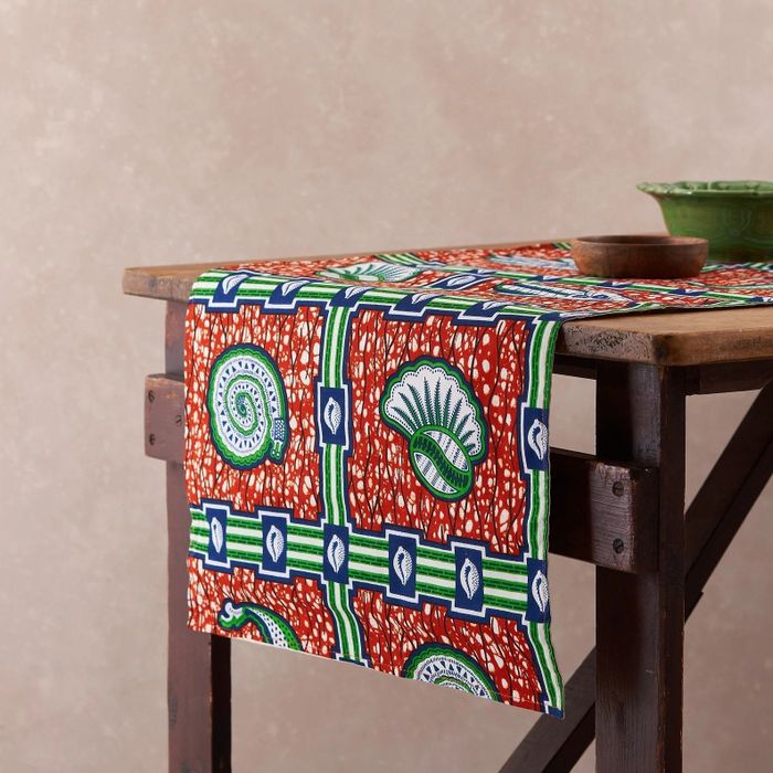 A colorful table runner is showcased