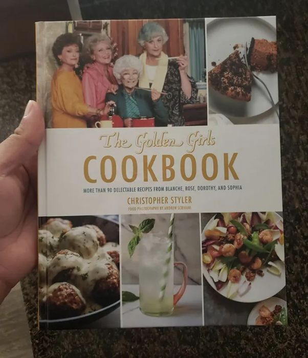 A customer-submitted photo showing them holding the cookbook