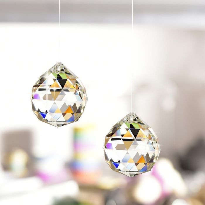 Two suncatchers hanging from the ceiling