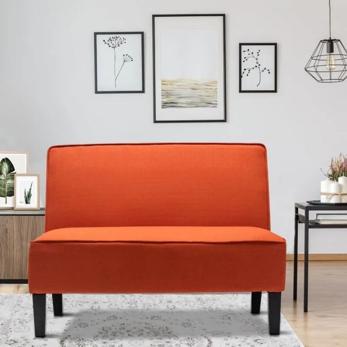A bold, orange couch that brings a burst of warmth and personality to any space.