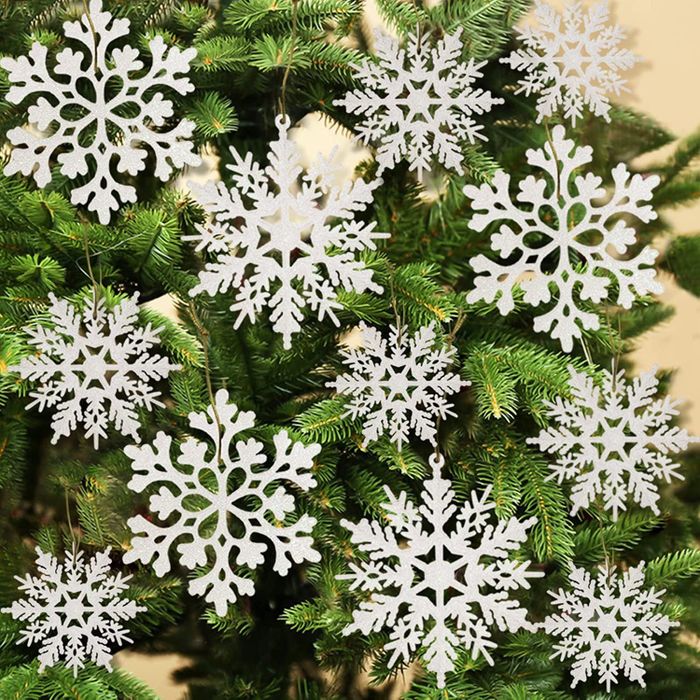 white snowflake ornaments dusted with glitter