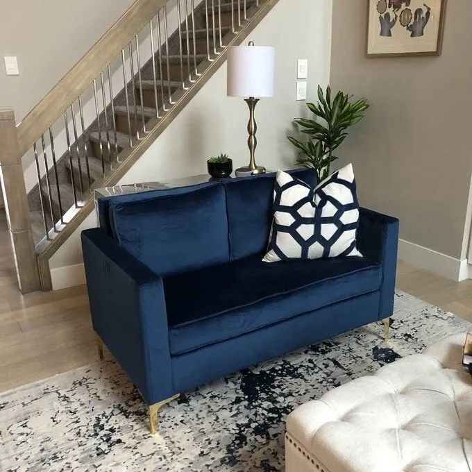 A customer's photo of the blue version of the couch