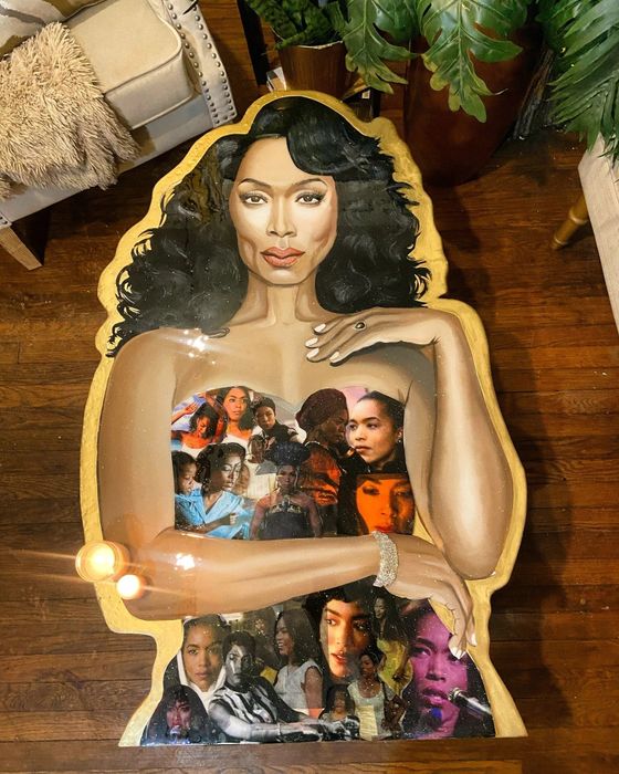 A coffee table adorned with an image of Angela Bassett