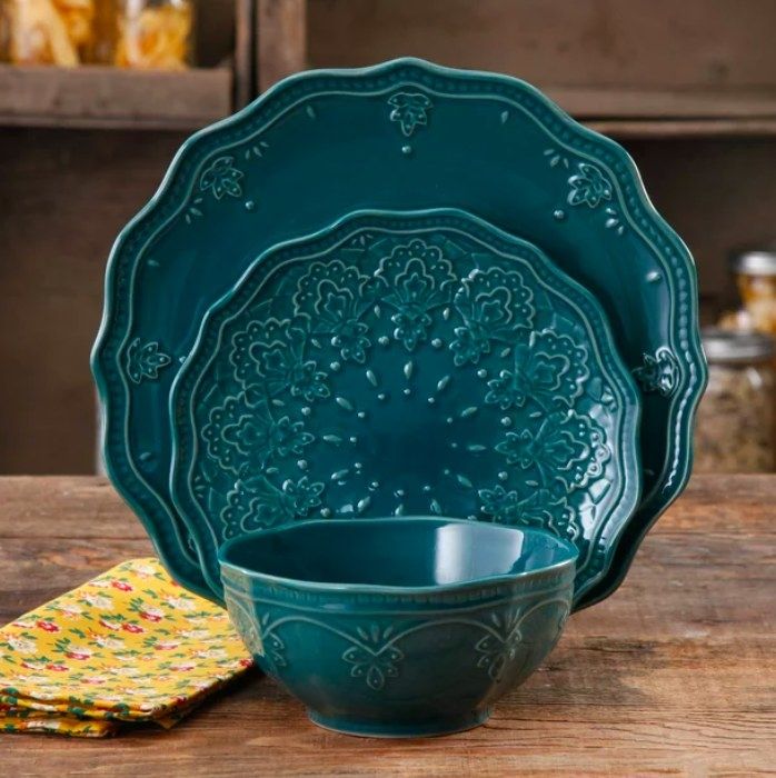 Teal dinner plate, salad plate, and bowl, perfectly matching to create a vibrant and cohesive dining set.
