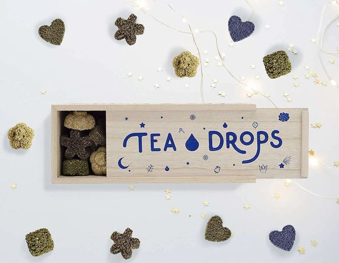 A box of Tea Drops opened to reveal the delightful tea morsels inside.