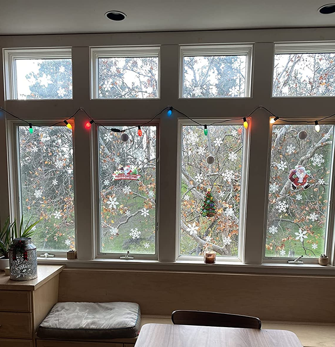 reviewer photo showing the snowflake decals adorning four windows