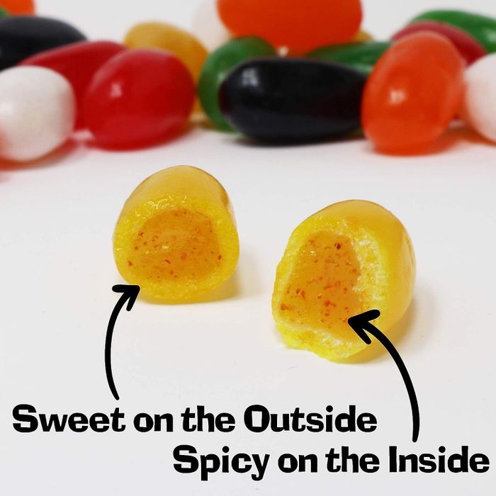 A jelly bean sliced in half, revealing the spicy interior 