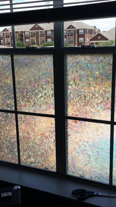a reviewer’s window adorned with holographic geometric frosted film