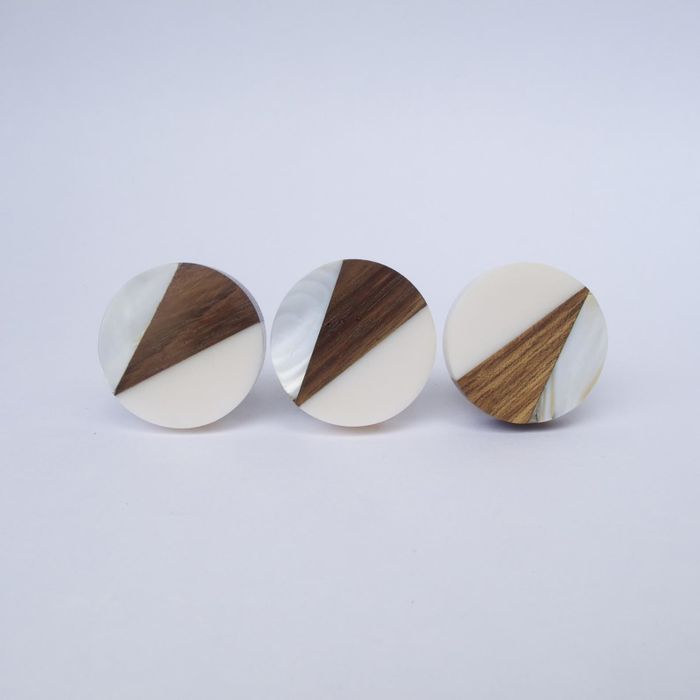 Circular flat knobs adorned with a geometric triangle design in wood, silver, and mother-of-pearl