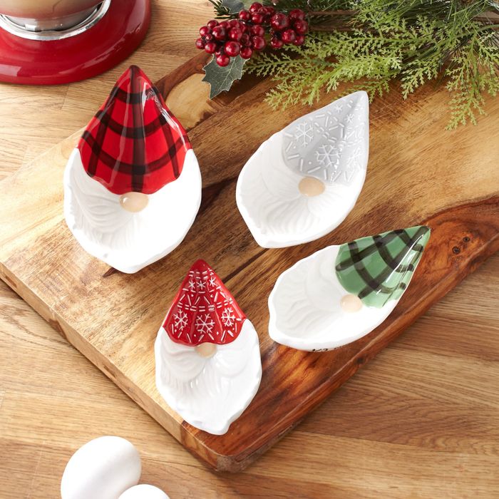 A set of four gnome-themed measuring cups.