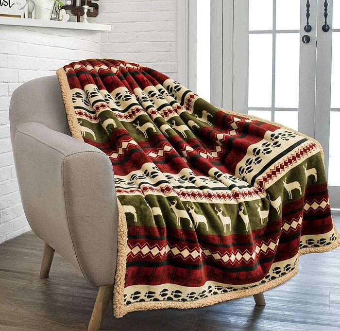 The blanket draped over a chair, adding a cozy touch