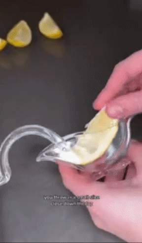 a model squeezing a lemon into a jar