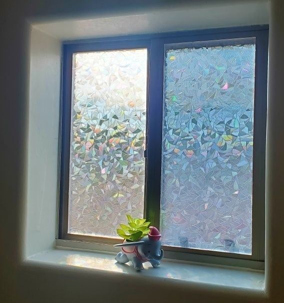 a reviewer's photo of a bathroom window featuring the privacy film