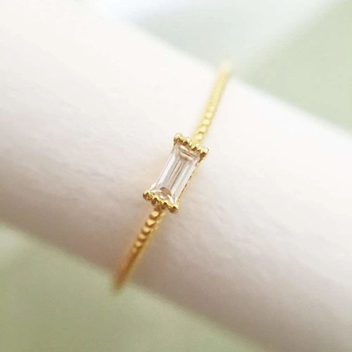 A close-up of the elegant rhinestone ring, capturing its intricate design.