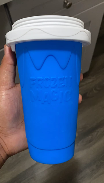 A small, cup-shaped slushy maker