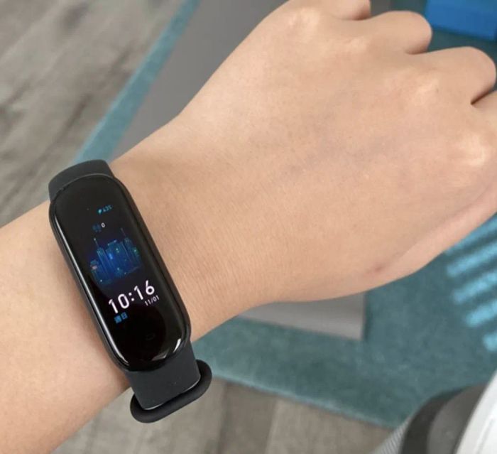 A customer photo showcasing them wearing the fitness tracker in black, ready for any workout or daily adventure.