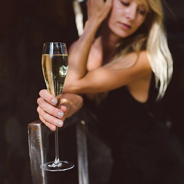 A person holding a champagne flute.