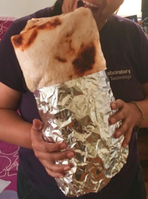 the blanket folded to resemble a burrito, complete with aluminum foil wrapping